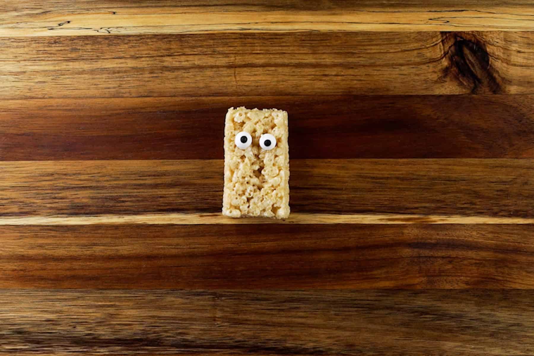rice krispy rectangle with candy eyes affixed.