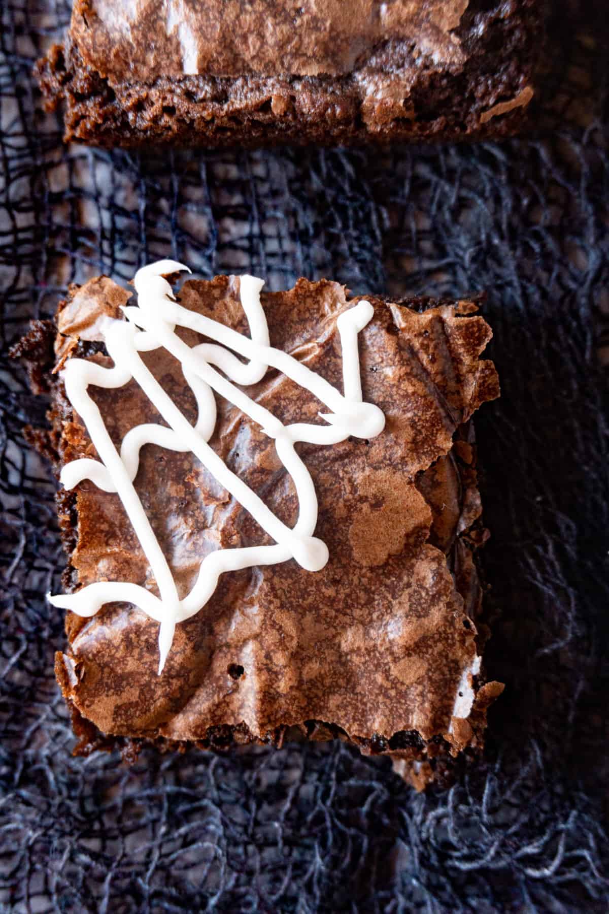 Easy Spider Web Brownies are fun to make and perfect for a Halloween party! spider web brownie close up