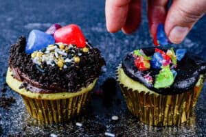 adding crushed jolly ranchers to cupcake