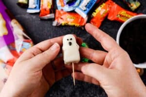 adding a toothpick tot he bottom of the ghost candy
