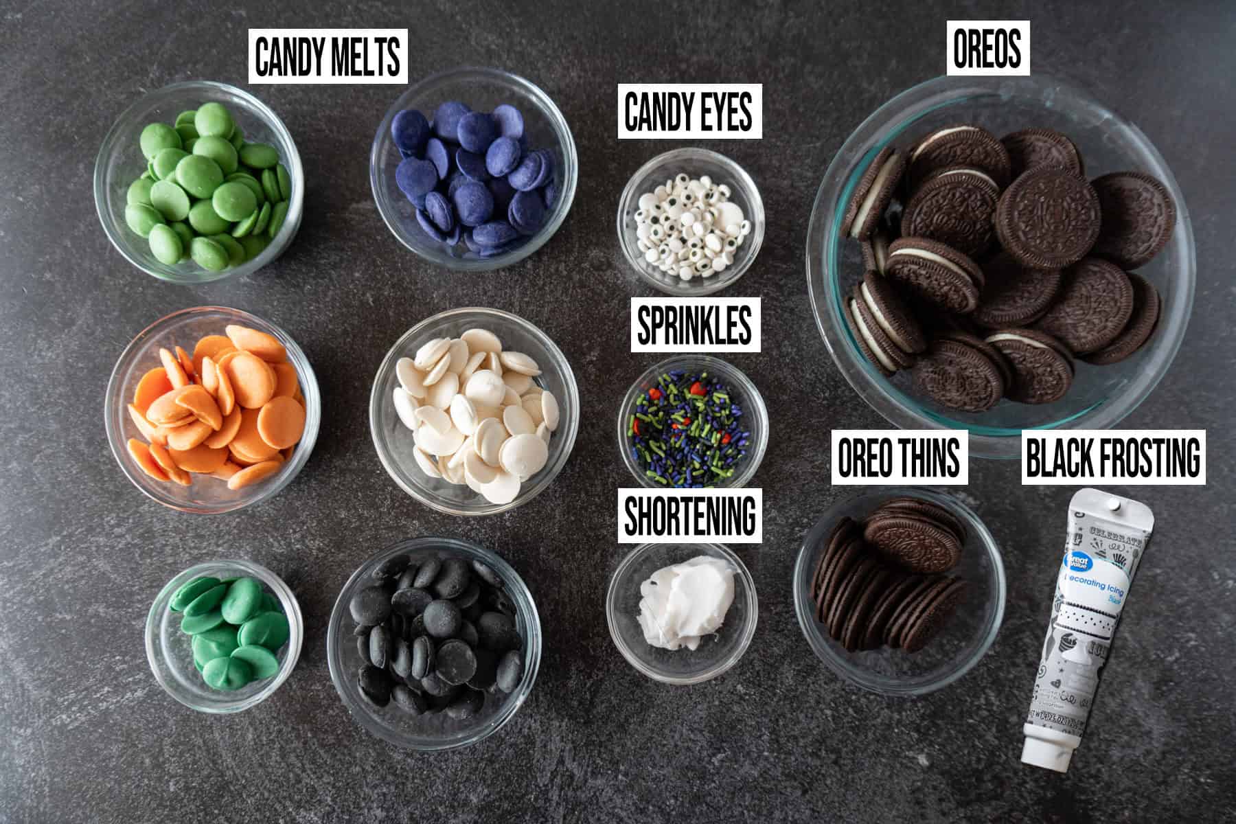 Halloween Oreo ingredients in individual bowls and labeled.