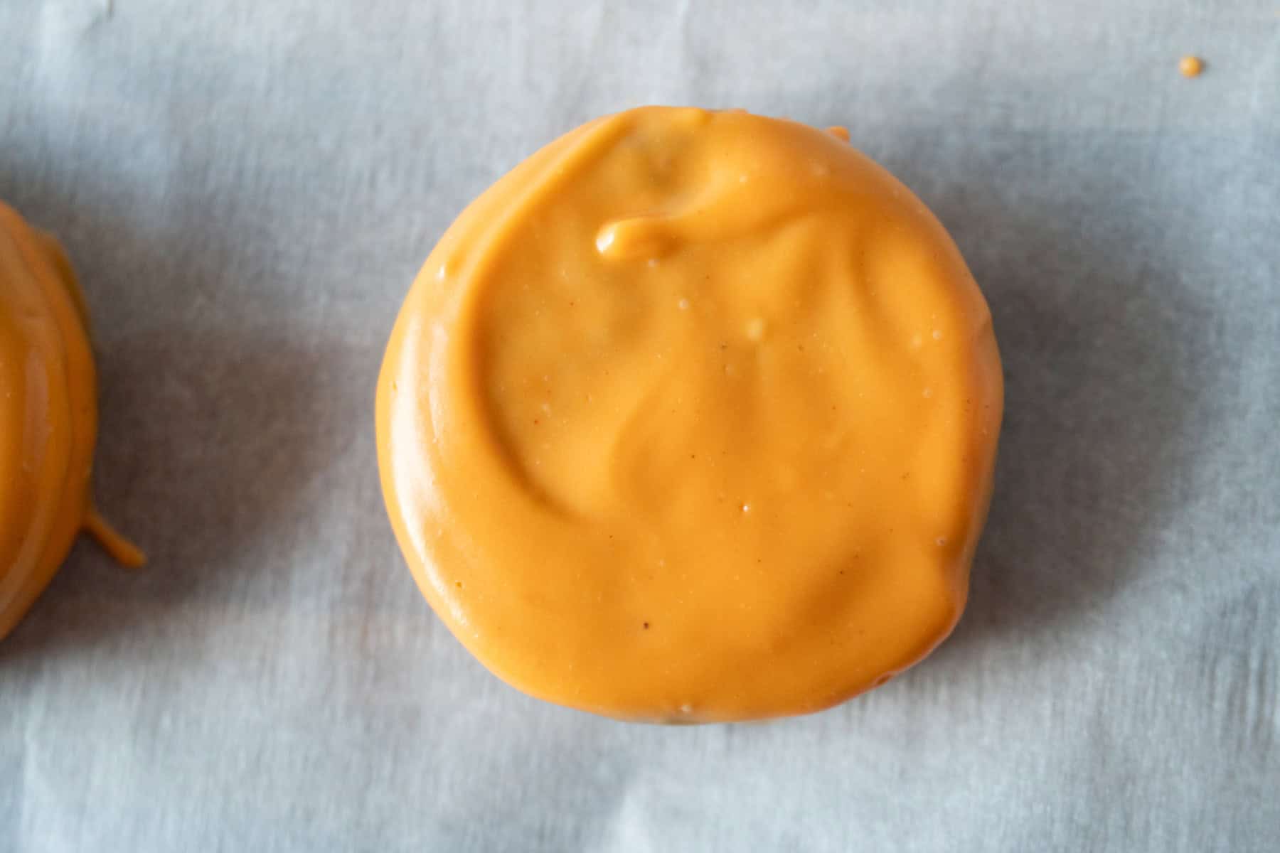 Oreo dipped in orange candy melts.