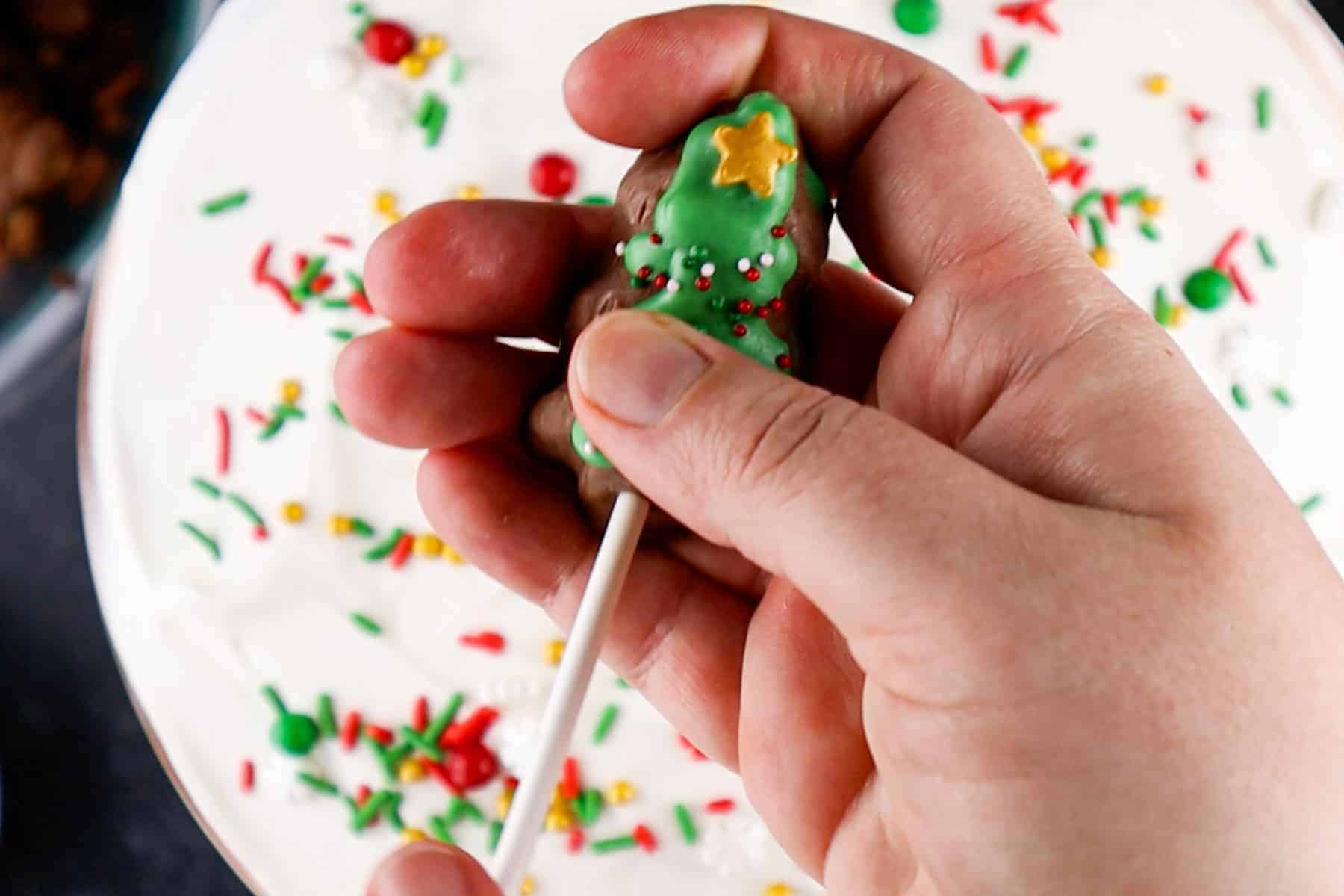 adding a skewer to the bottom of a reese's tree