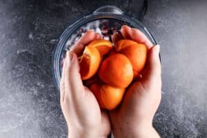 adding quartered clementines to food processor