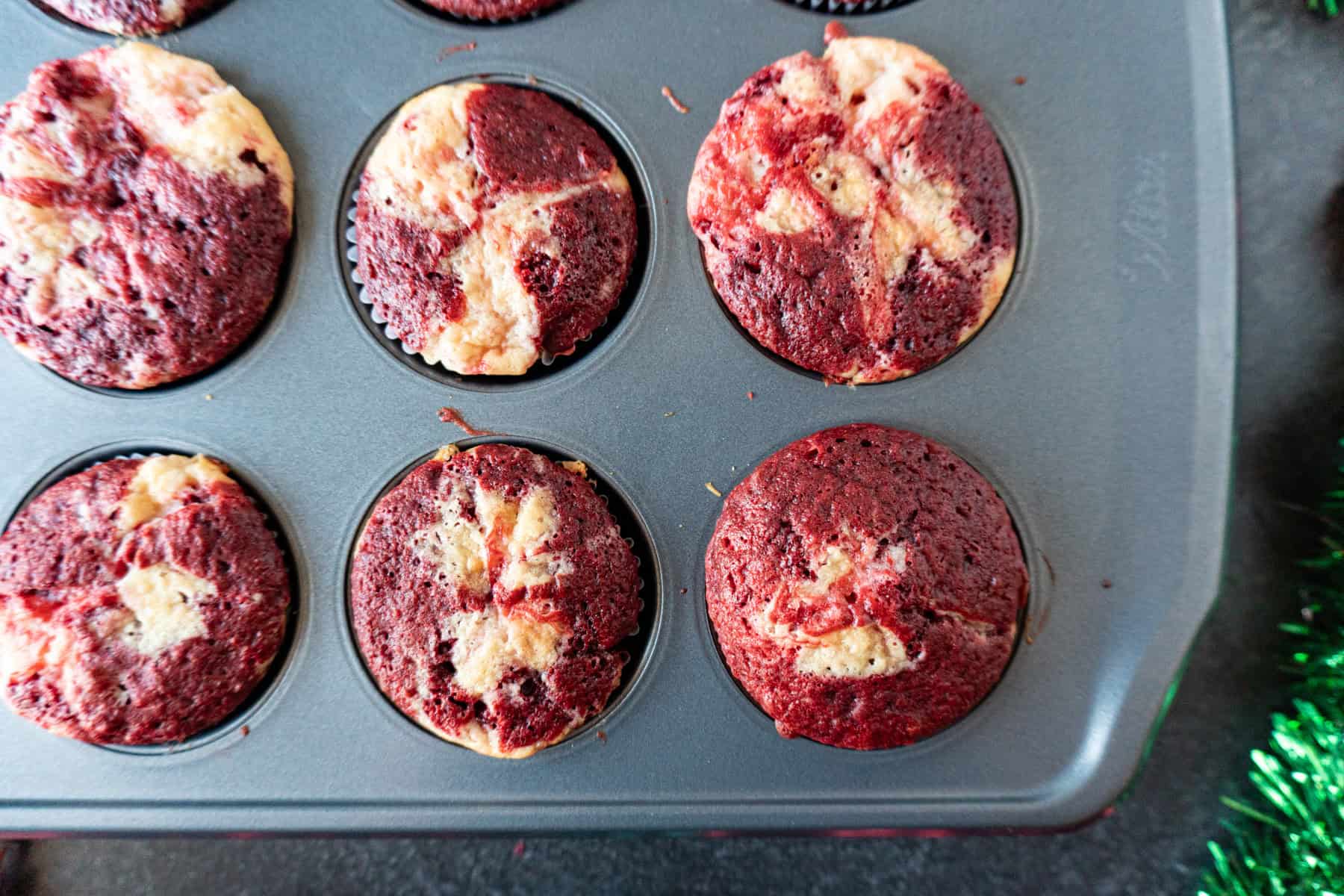 Candy cane cupcakes baked and still in muffin tin.