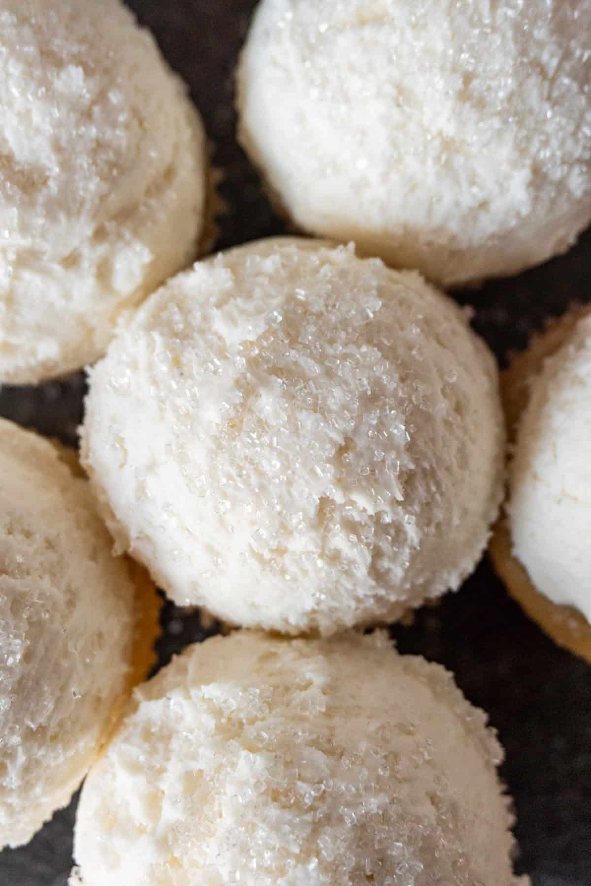snwoball cupcakes bunched together to look like a pile of snowballs.
