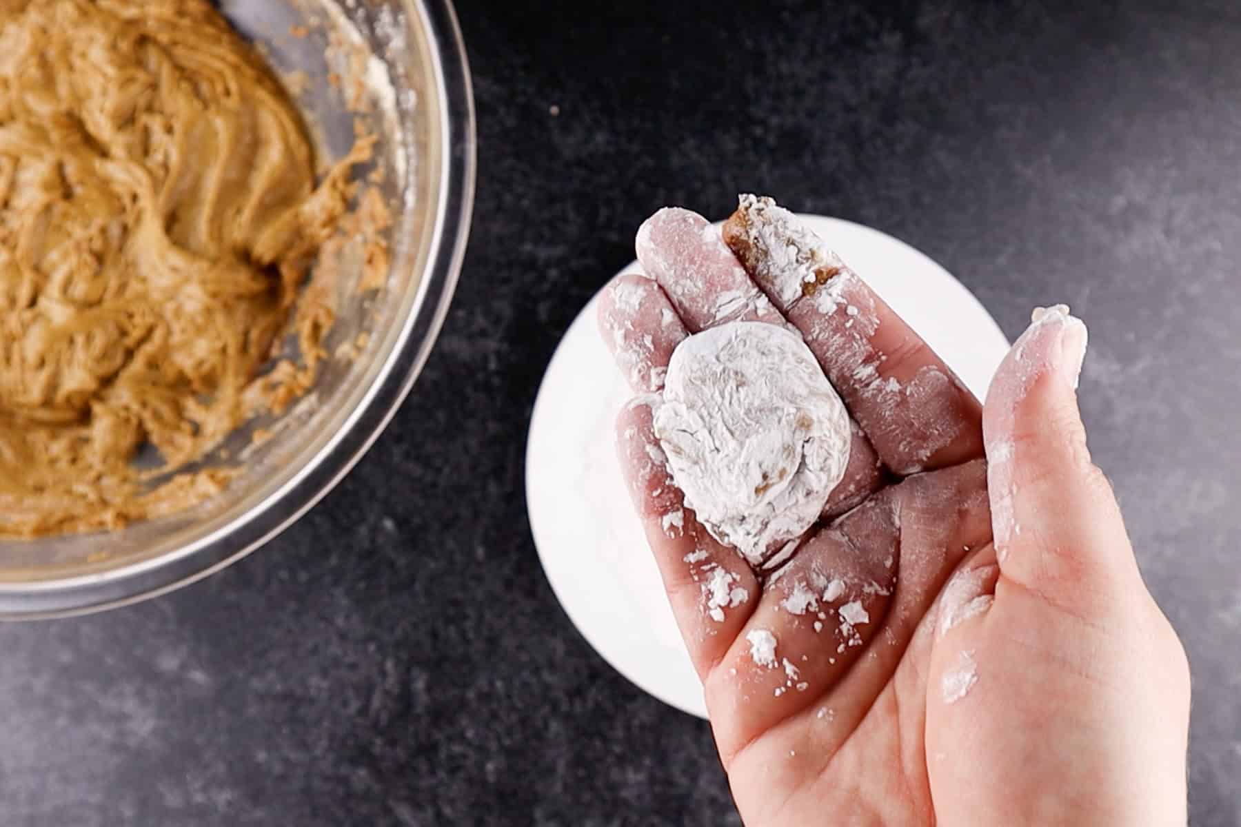 gingerbread crinkle cookie dough rolled in powdered sugar.