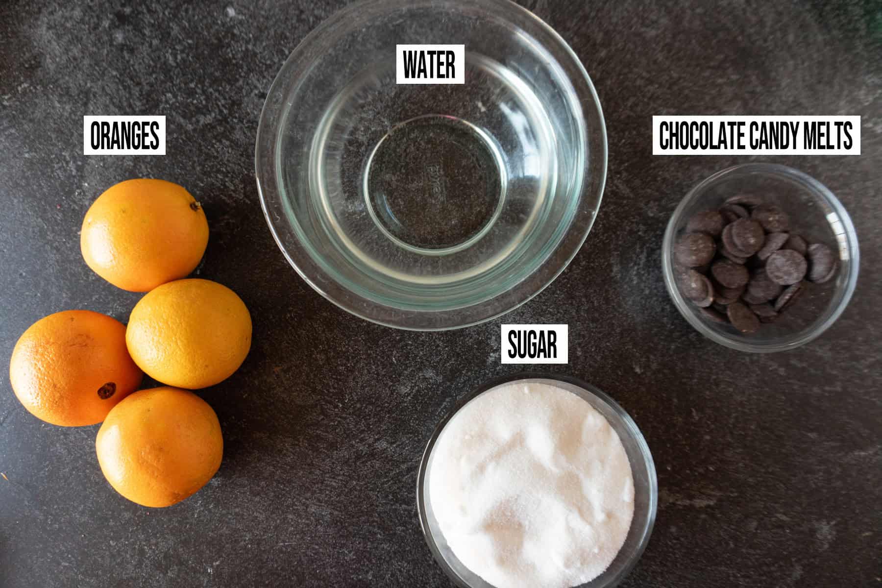 candied orange peels Ingredients in individual bowls and labeled