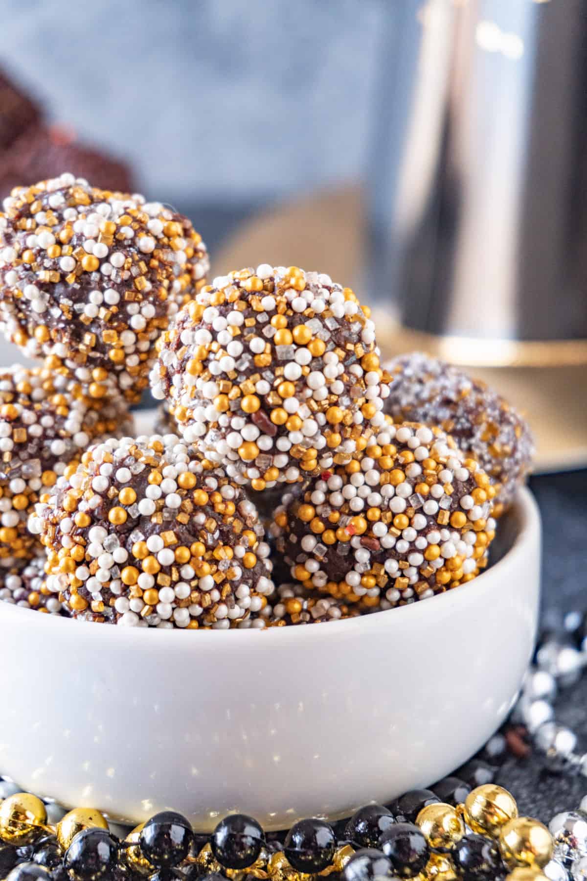 chocolate truffles with gold and silver sprinkles close up