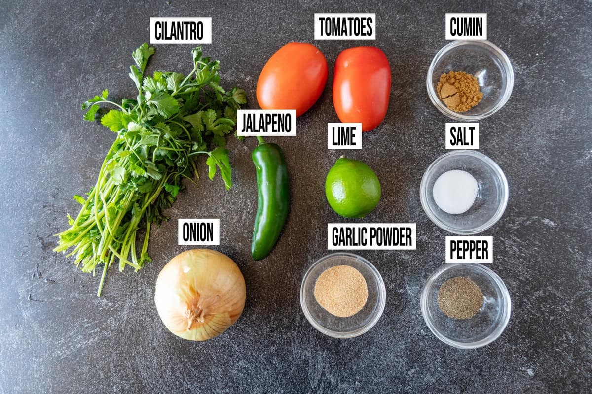pico de gallo ingredients in individual bowls and labeled.