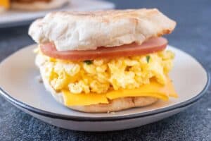 scrambled egg breakfast sandwich on plate