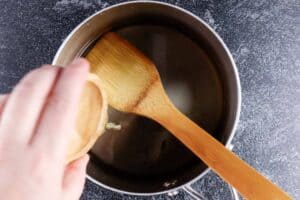 adding mint extract to saucepan