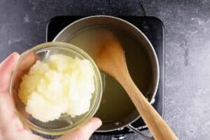 adding lemonade concentrate to sauce pan