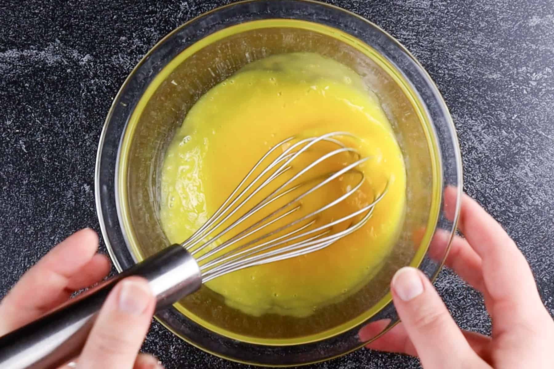 whisked egg yolks in a bowl.