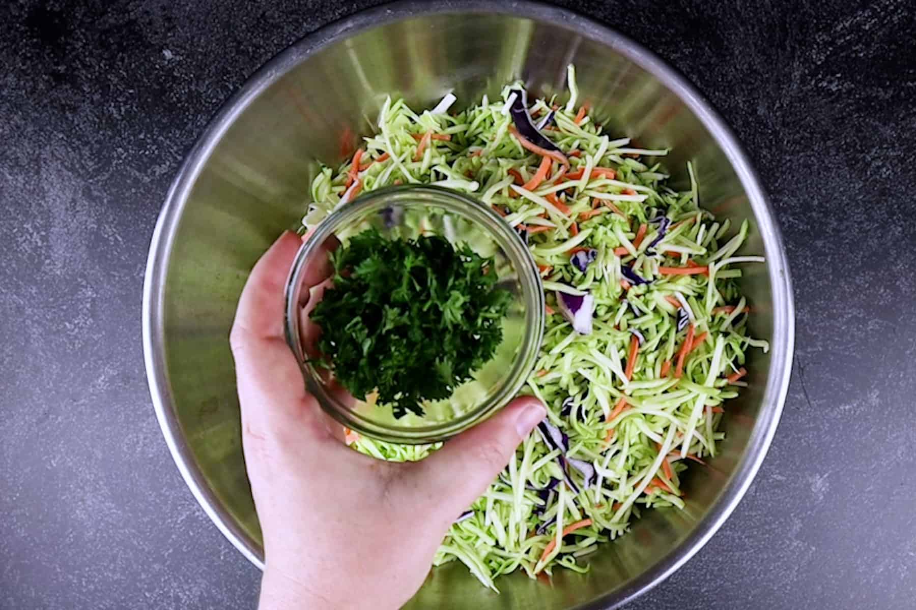 adding parsley to broccoli slaw