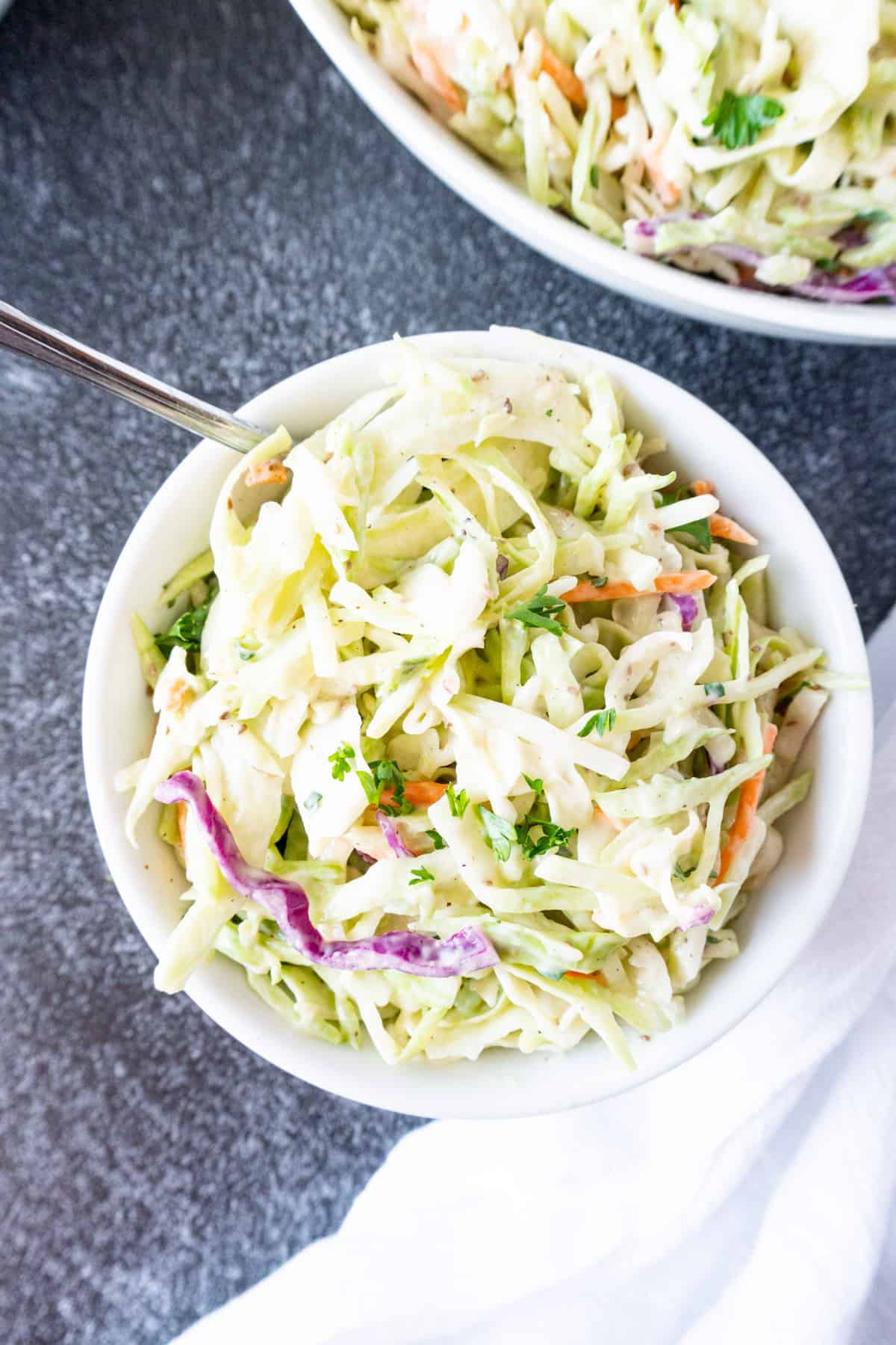 broccoli slaw in small white bowl