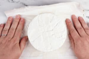 taking the wrapping off the brie