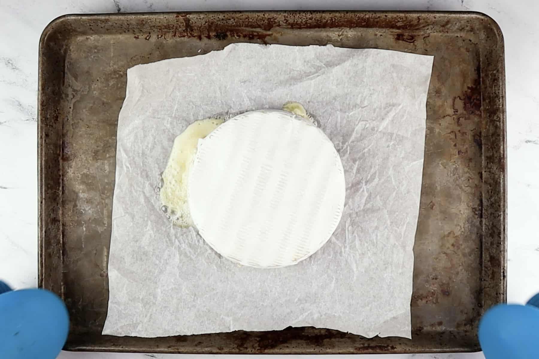 brie baked and still on baking sheet