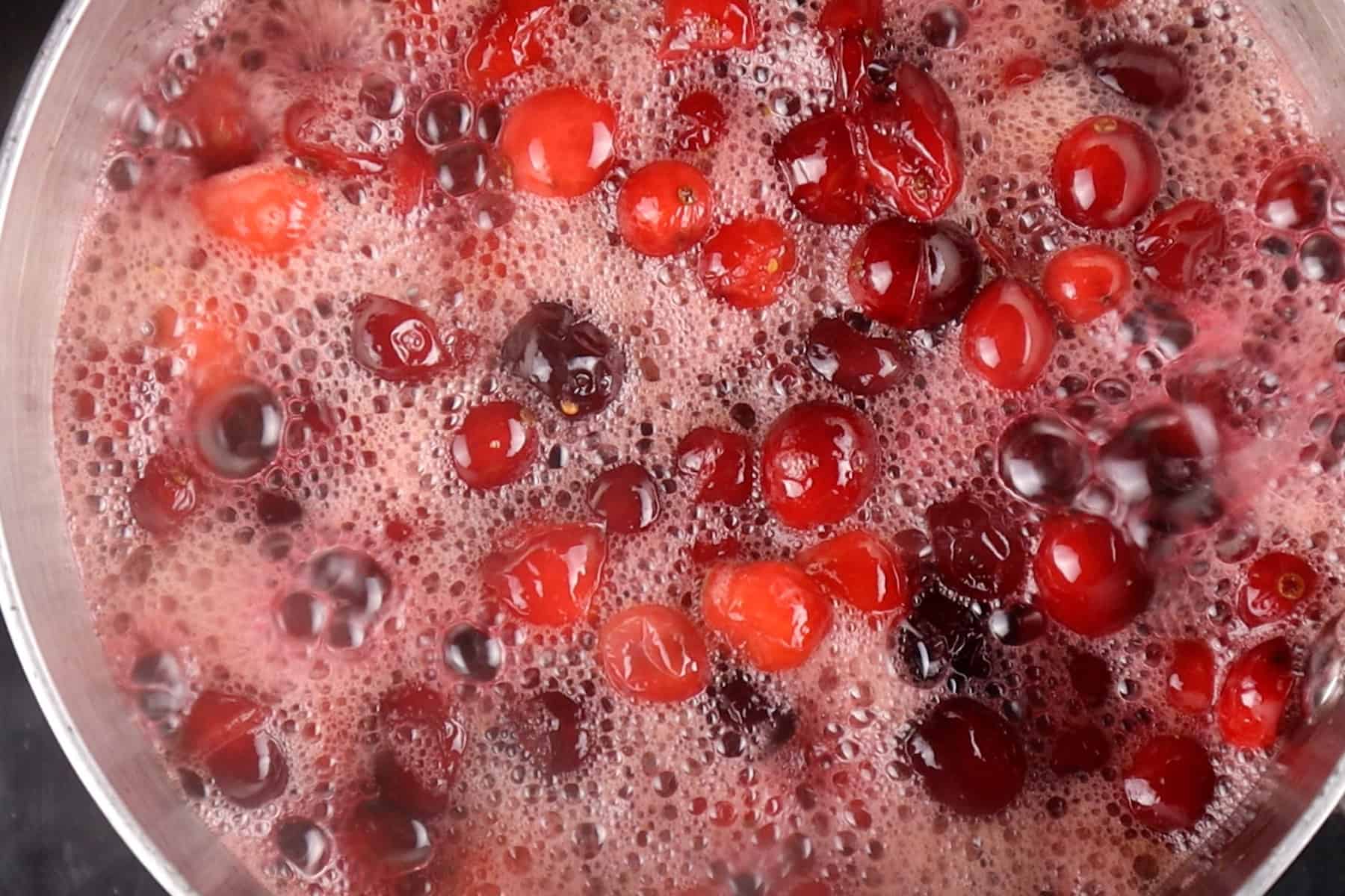 cranberries boiling in saucepan