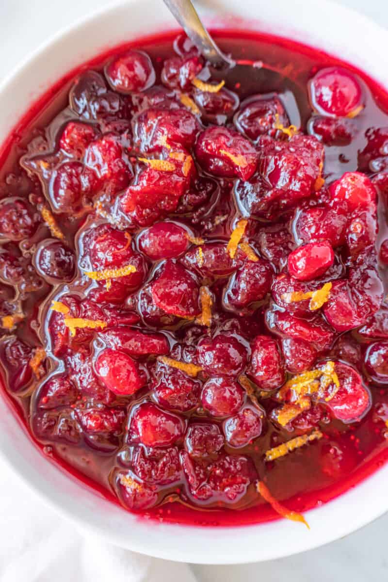 cranberry relish in bowl with spoon