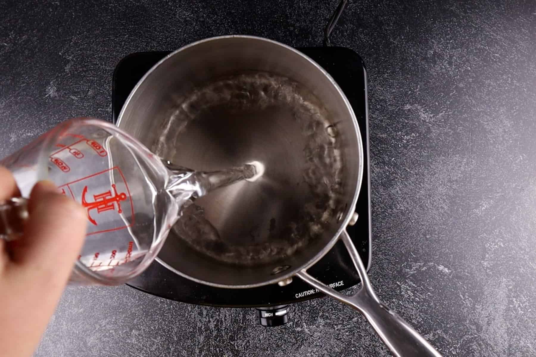 adding water tp sauce pan