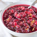 Cranberry sauce in white bowl featured image