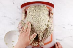 rubbing butter over turkey