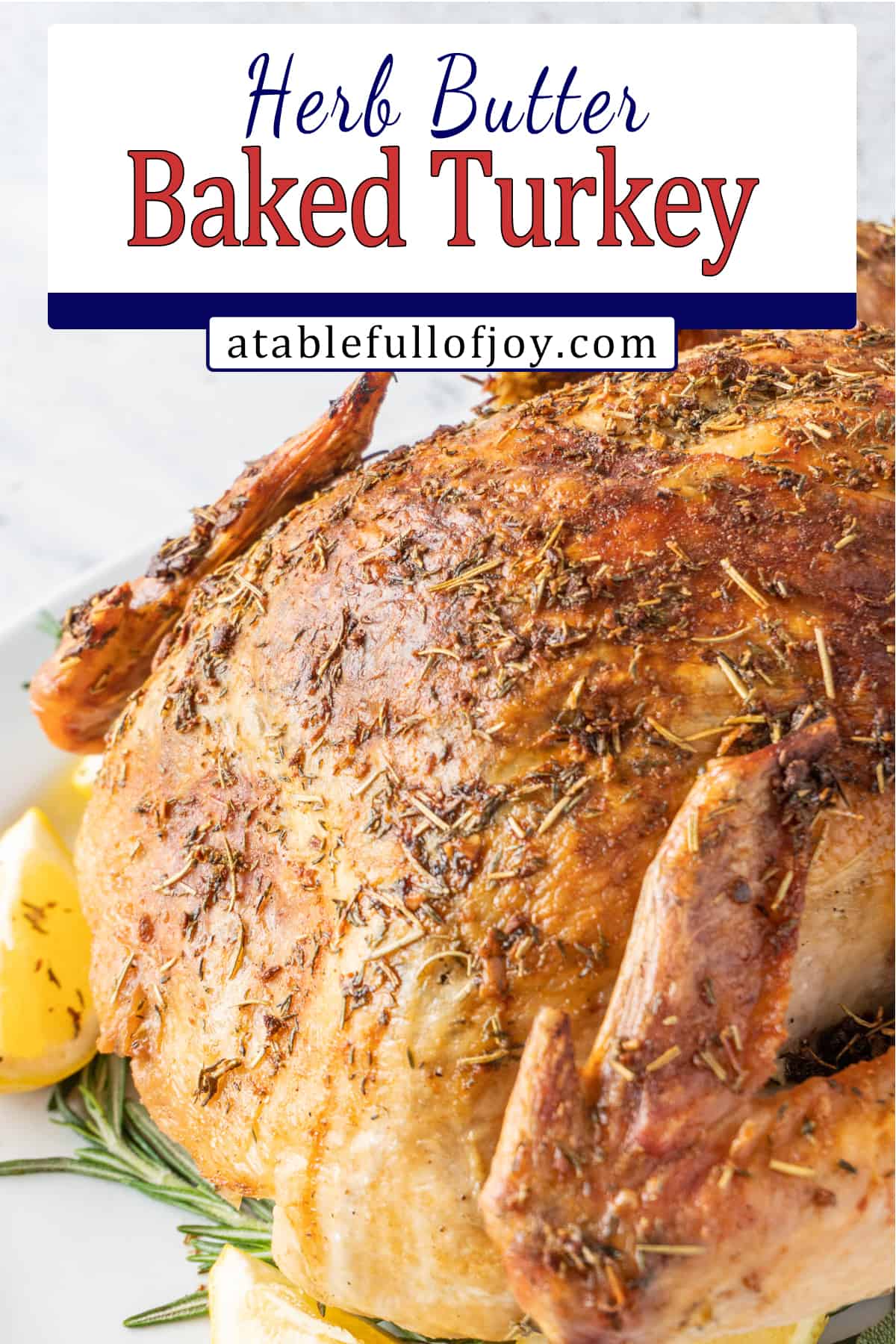 baked turkey on platter with lemon and sage leaves around it pinterest pin