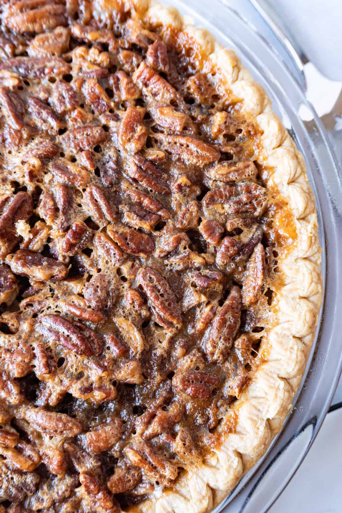 close up of whole baked pecan pie