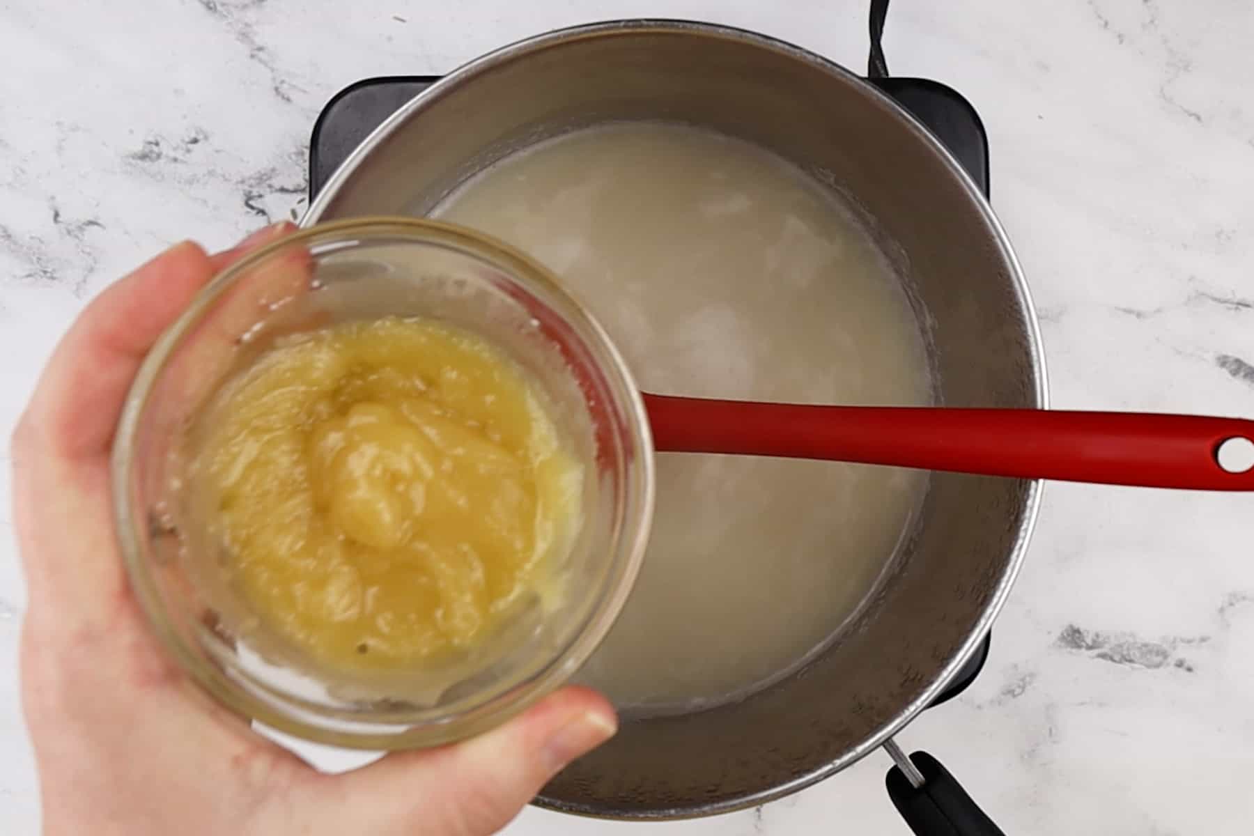 adding thickener to sauce pan