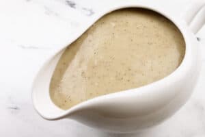 close up of gravy in white gravy boat