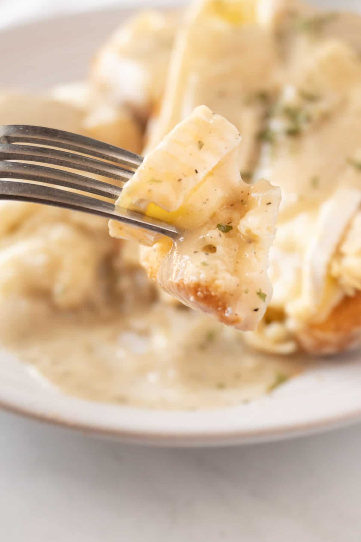 hot turkey sandwich with gravy on fork