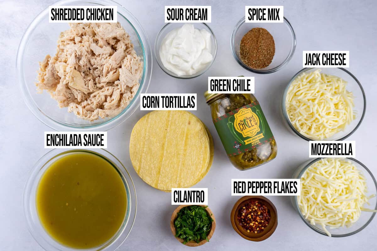 sour cream enchilada ingredients in bowls and labeled.