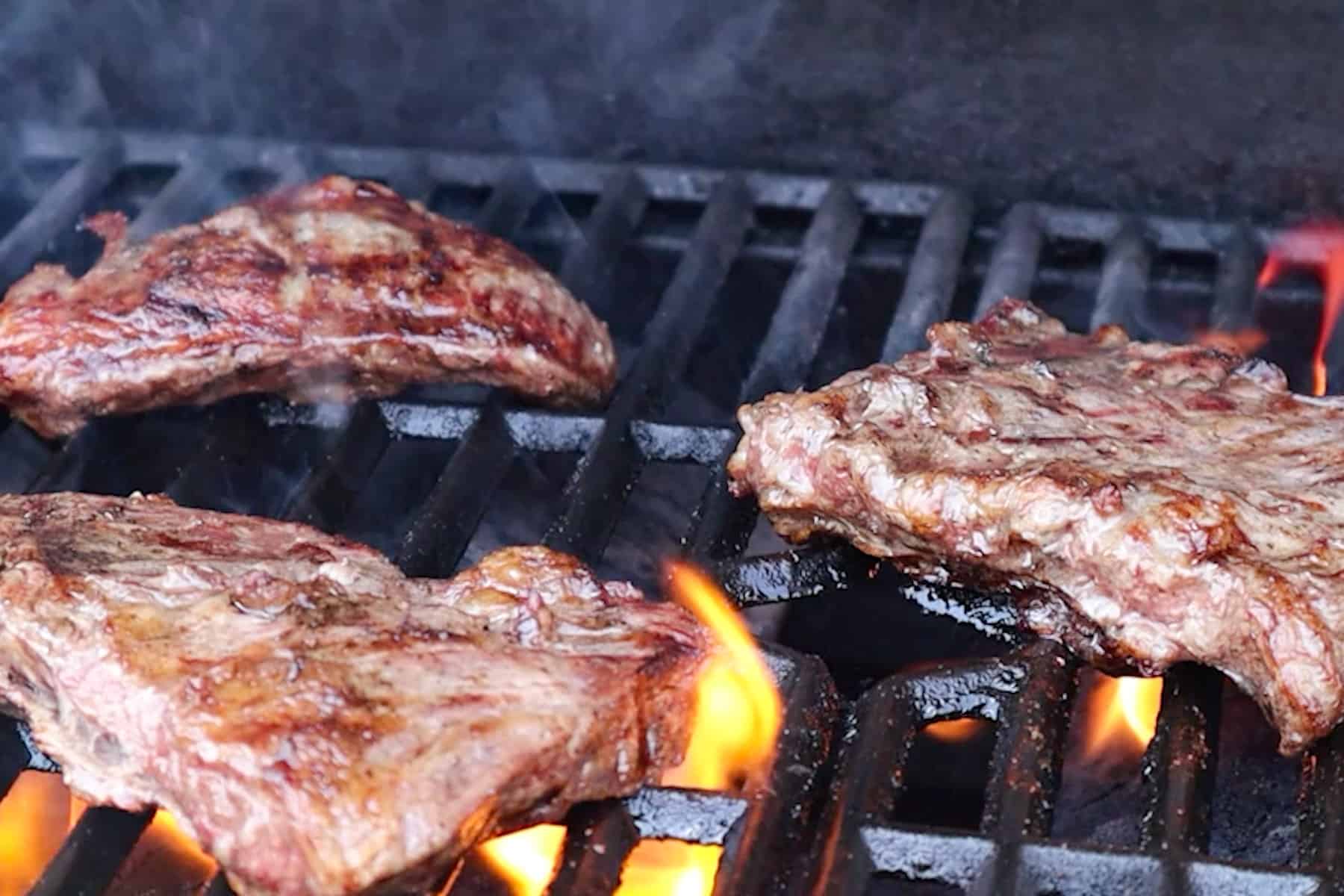 grilling steak on bbq