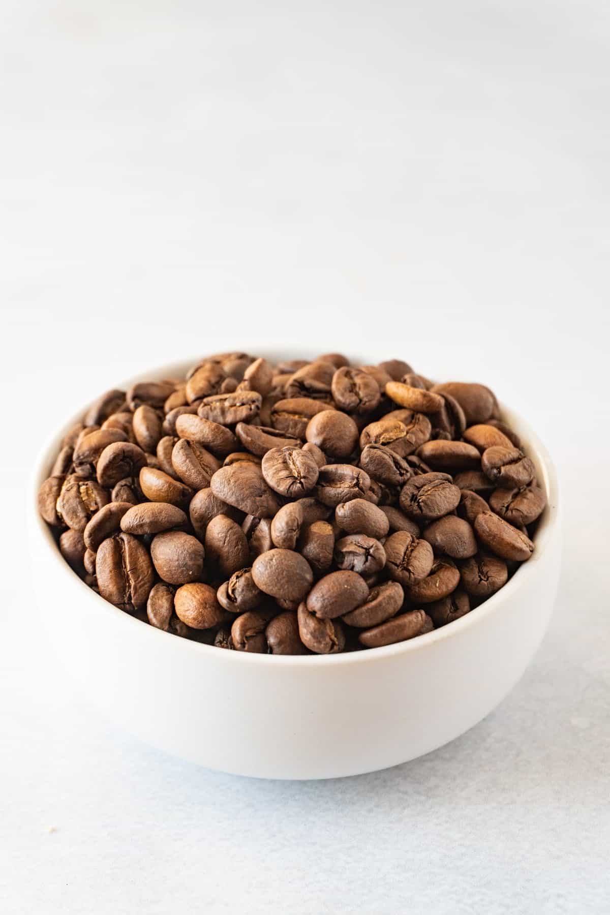 coffee beans in a white bowl