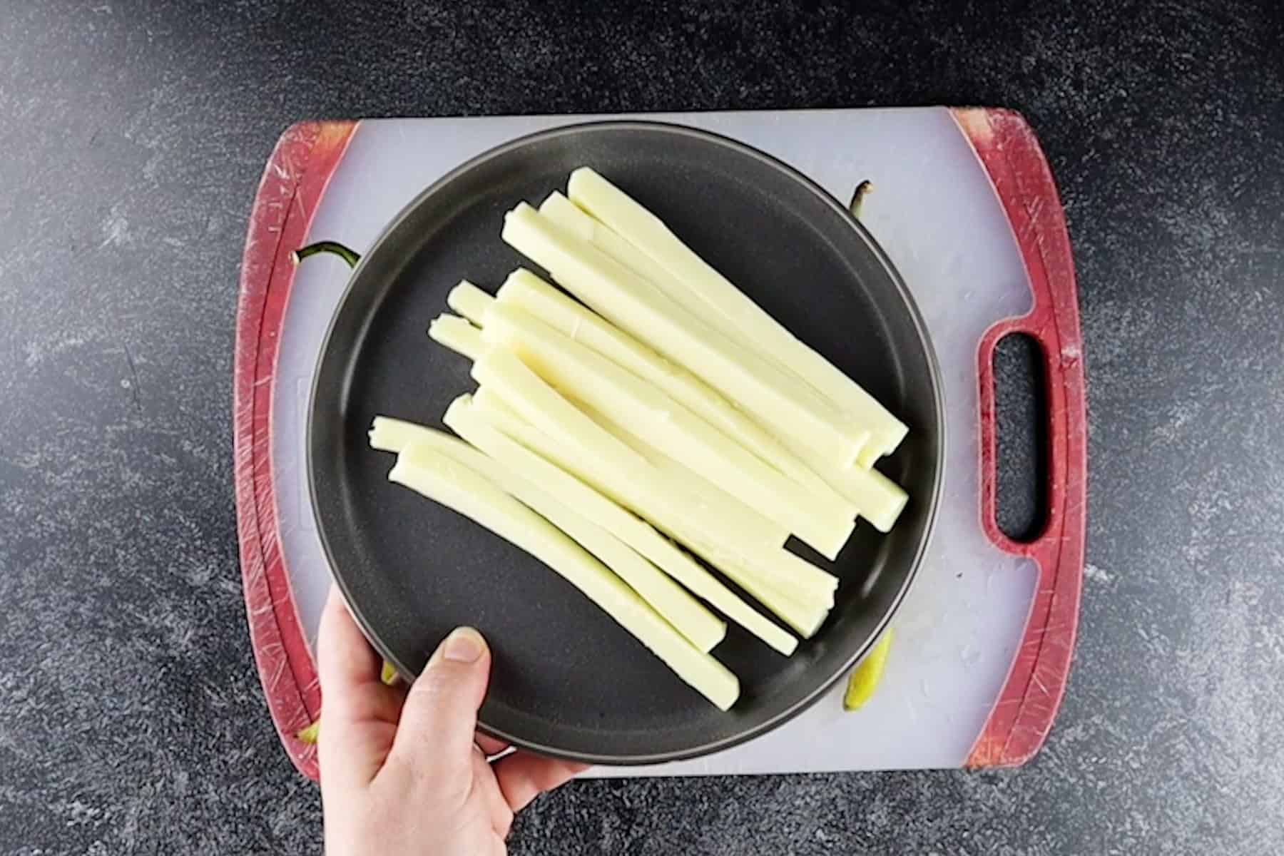 cheese cut into strips on plate