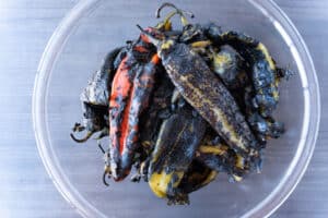 roasted green chile in in bowl with blackened skin