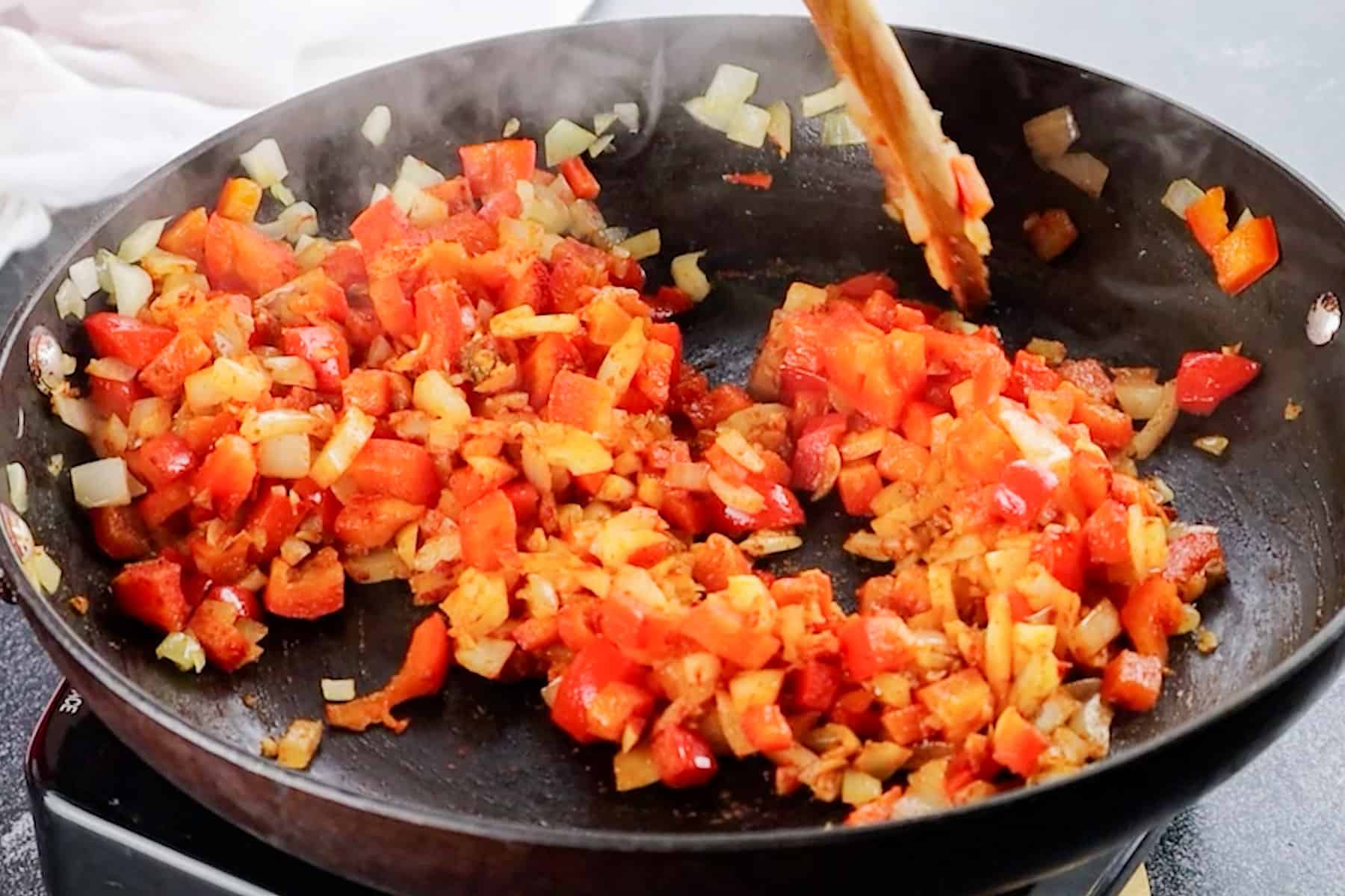 stirring in spices and garlic