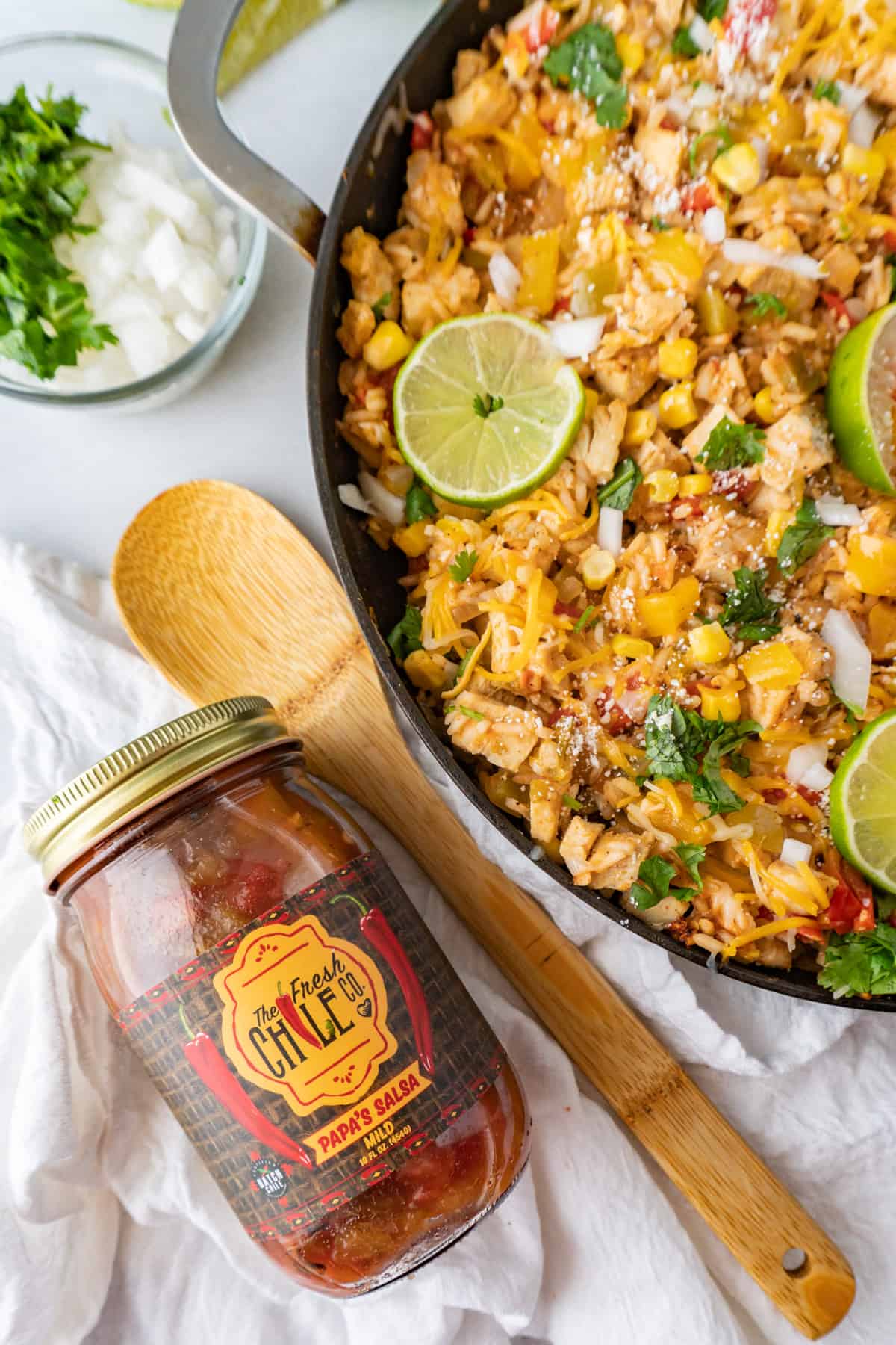 southwest chicken in pan next to jar of salsa