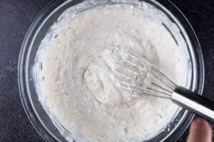 milk, cream cheese, cream of mushroom soup and pepper in bowl