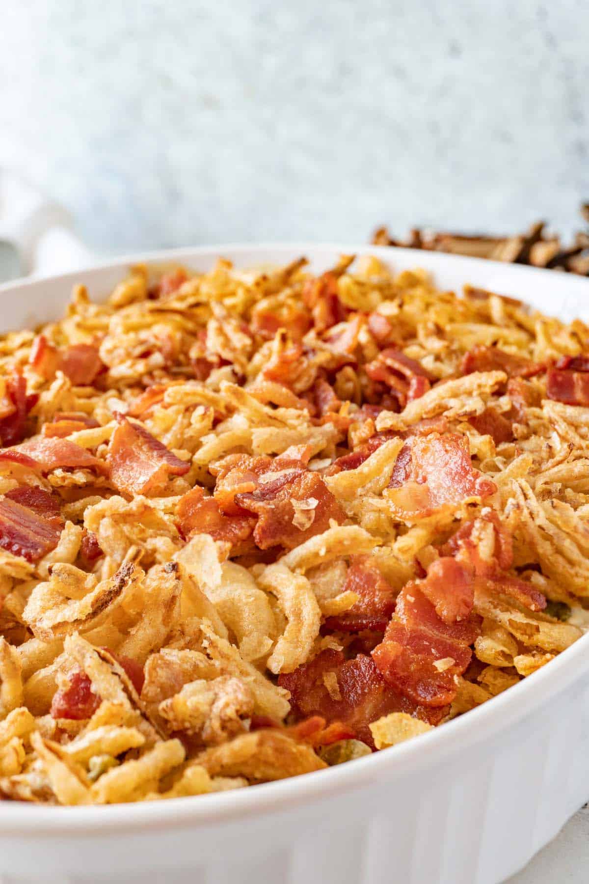 green bean casserole with cream cheese in baking dish