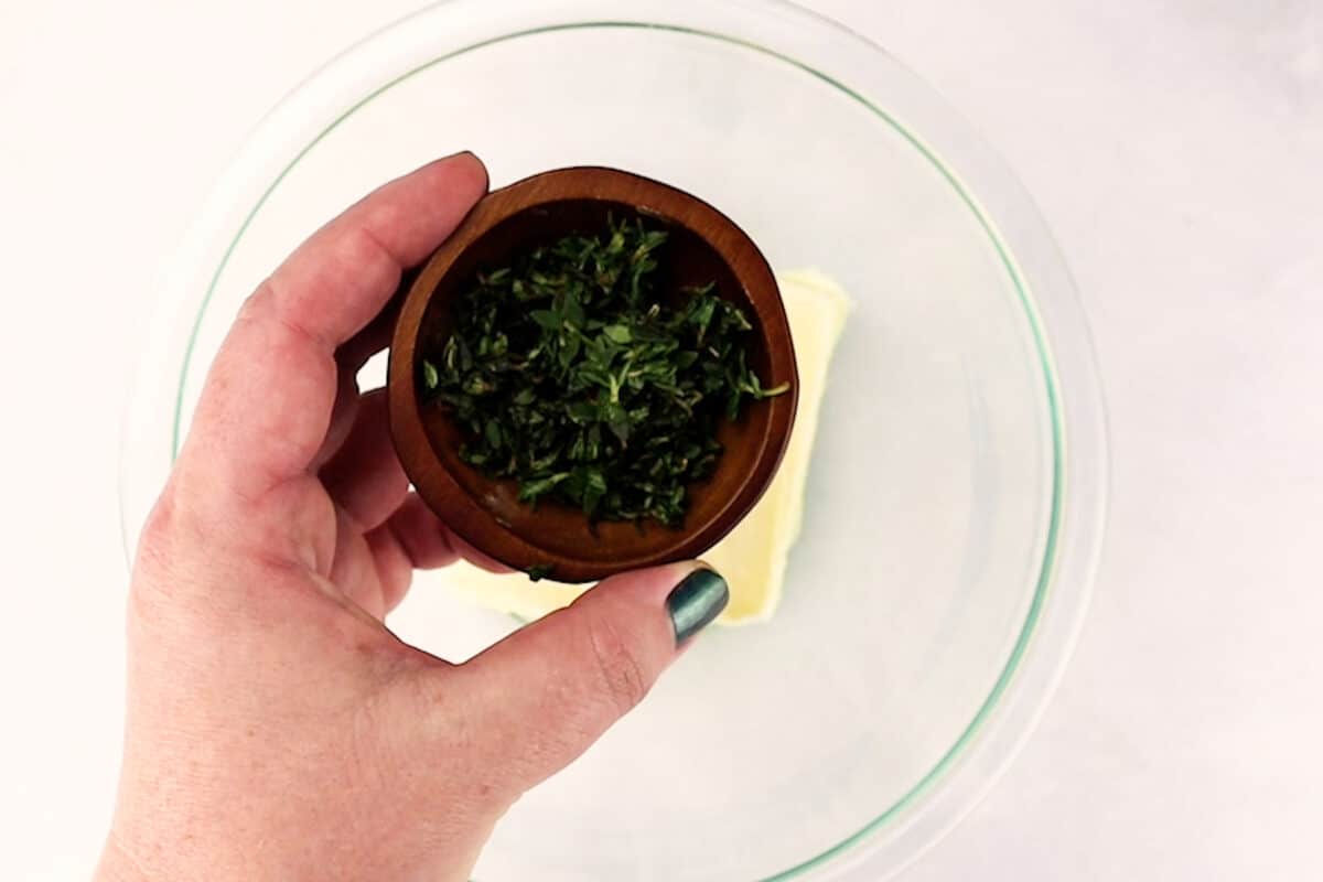 adding rosemary to butter