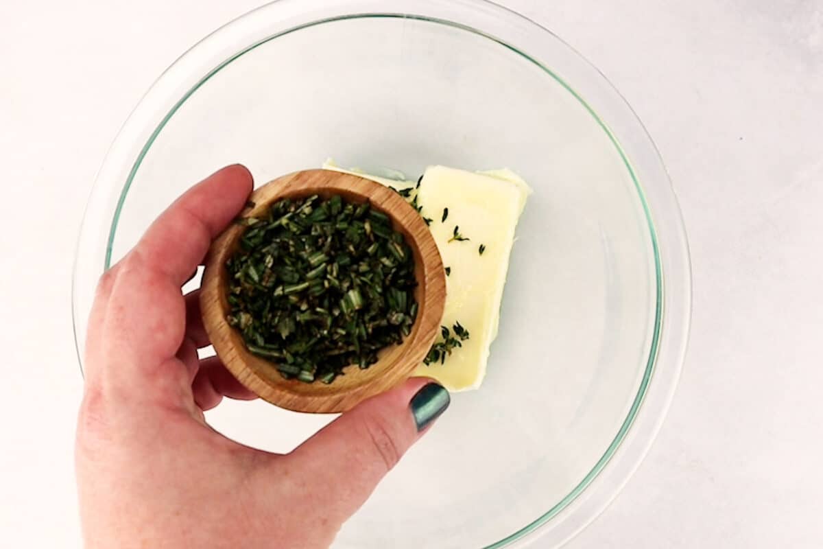adding thyme to butter