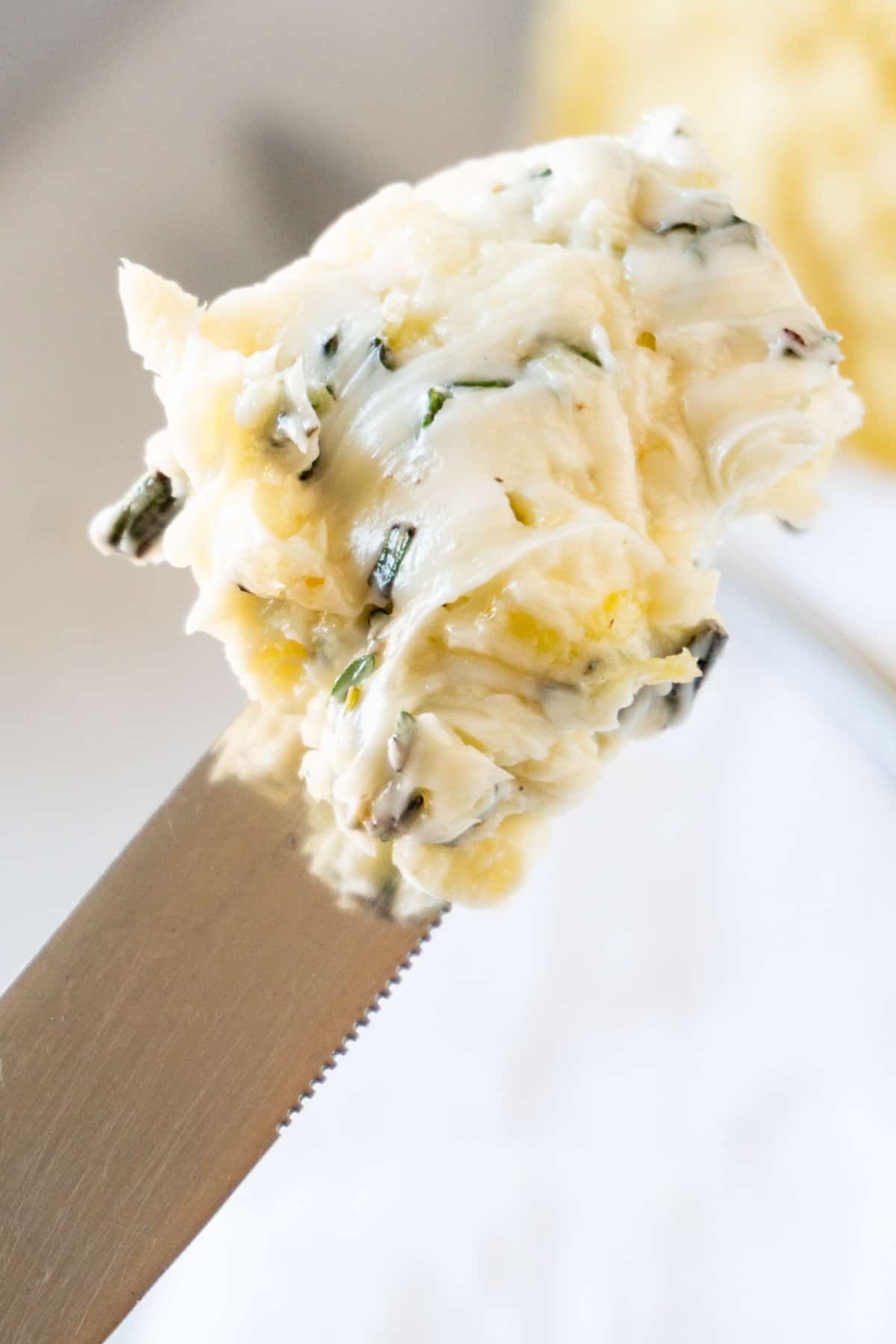 garlic herb butter on knife