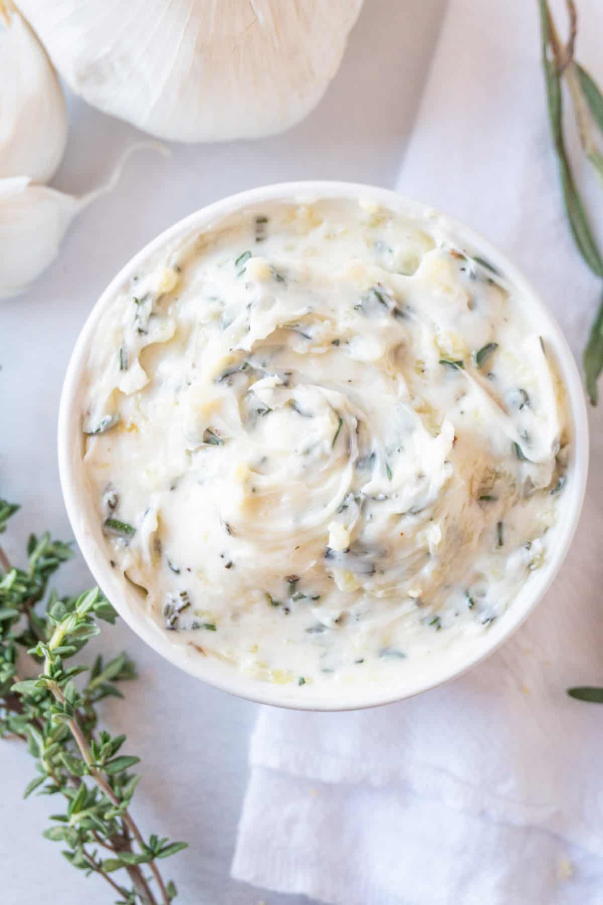 garlic herb butter in white bowl