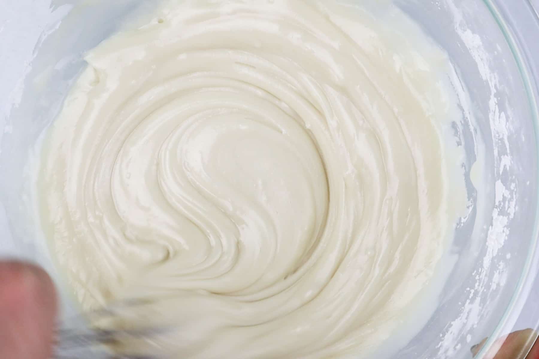 royal icing mixed in glass bowl.