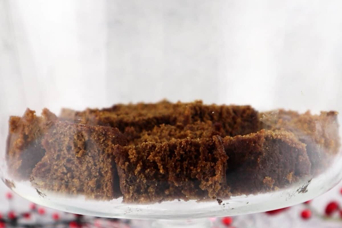 adding first layer of gingerbread cake