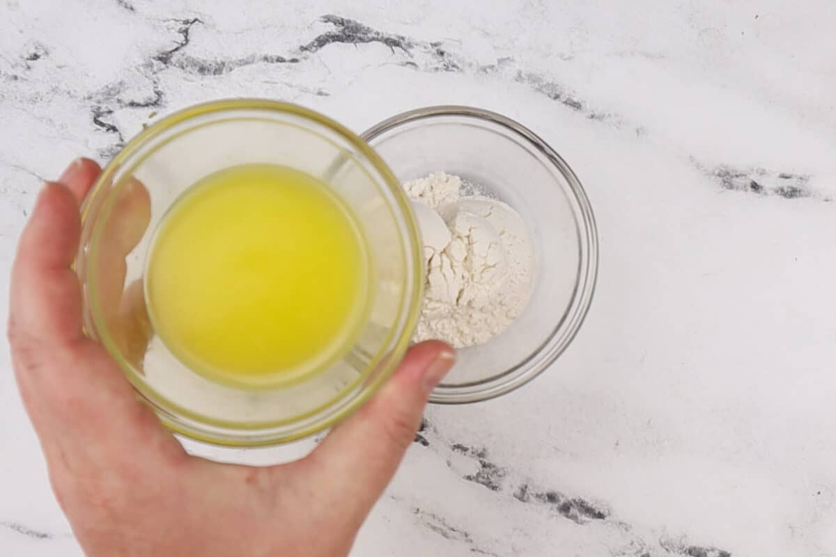 adding butter to flour