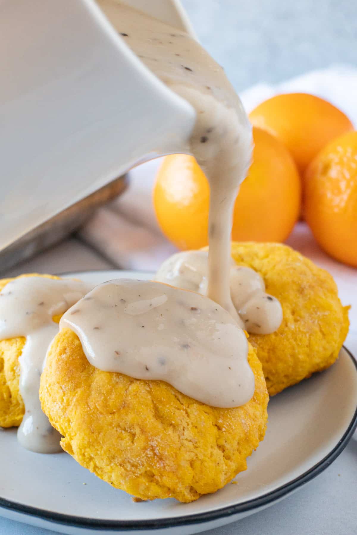 pouring gravy on biscuits