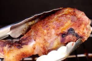 removing smoked chicken leg from smoker